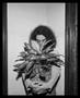 Photograph: [Marcella holding a plant]