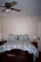 Photograph: [A bedroom at the Redbud Inn, 2]