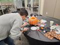 Primary view of [Kristian Enbysk decorating a pumpkin]