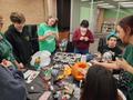 Primary view of [Large group decorating their library pumpkin]