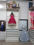 Photograph: [Cabinet storage showing evening dresses]