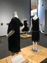Photograph: [Outfits on display for "Black Dress" exhibition]