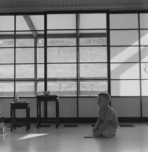 Primary view of object titled '[A boy playing in a Japanese-inspired cabin, 5]'.