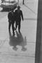 Photograph: [Two men walking away from a car, 1]