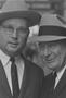 Photograph: [Close-up of two men in suits and hats, 3]