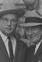 Primary view of [Close-up of two men in suits and hats, 4]