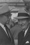 Primary view of [Close-up of two men in suits and hats, 8]