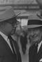 Photograph: [Close-up of two men in suits and hats, 9]