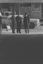 Photograph: [Three men talking on a street, 1]