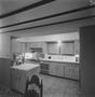 Photograph: [A kitchen with wooden cabinets, 1]