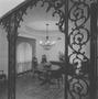 Photograph: [A filigree archway before a dining area, 2]