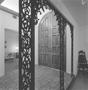 Photograph: [Filigree archways beside doors, 2]