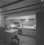 Photograph: [A kitchen with wooden cabinets, 2]