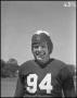Photograph: [Jersey Number 94 Football Player Smiling for the Camera]