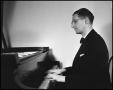 Photograph: [Walter Robert playing piano]