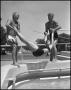 Photograph: [Woman being dropped into pool]