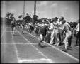 Photograph: [Track Team Member at Finish Line]