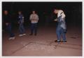 Photograph: [Four Men Viewing a Chalk Outline of a Body]