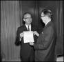 Photograph: [President J. C. Matthews holding a check, 2]