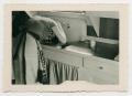 Primary view of [Woman Washing Her Hair in the Sink]