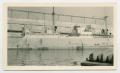 Photograph: [Large Ship Docked at Harbour]
