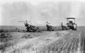 Photograph: [Photograph of farmers using tractor machines]