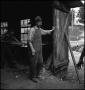 Photograph: [Man standing in a threshold]