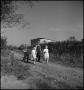 Photograph: [Boys and girls walking along a country road(2)]