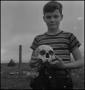 Photograph: [Raymond Clark holding a human skull, 3]