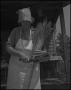 Photograph: [Aunt Nora Treece making a broom]