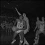 Photograph: [North Texas basketball player holds the ball]