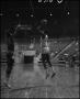 Photograph: [Two Basketball Players On The Court During Game]