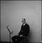 Photograph: [Maurice McAdow sitting in a chair]
