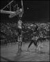 Photograph: [Basketball Player From Eagles Jumps Up To Dunk Ball Into Hoop]