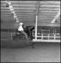 Photograph: [Full view of cowboy riding rearing horse]