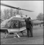 Photograph: [Betty Jane Briscoe entering helicopter]