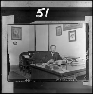 Primary view of object titled '[Dr. William Bruce sitting at desk]'.