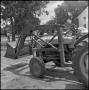 Photograph: [Tractor in lot]