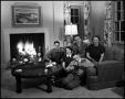 Photograph: [Family sitting in their living room]
