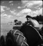Photograph: [Young man on a tractor]