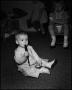 Photograph: [Baby Ed Krent playing with a toy flute]