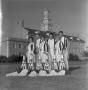 Photograph: [Six cheerleaders in front of the Hurley Administration Building, 3]