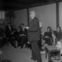 Photograph: [Priest speaking at Canterbury House, 3]