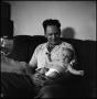 Photograph: [Joe Clark and Junebug on a couch]