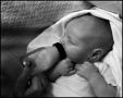 Photograph: [Newborn baby Junebug drinking, 4]