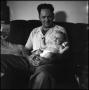 Photograph: [Joe Clark and Junebug on a couch, 9]