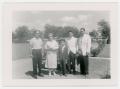 Photograph: [Frank Cuellar Sr. standing next to his family]
