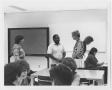 Photograph: [Herman Totten speaking to SLIS students]