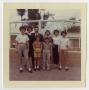 Photograph: [Family standing outside]
