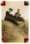 Photograph: [Frank Sr. and Gilbert Cuellar sitting on a hill]